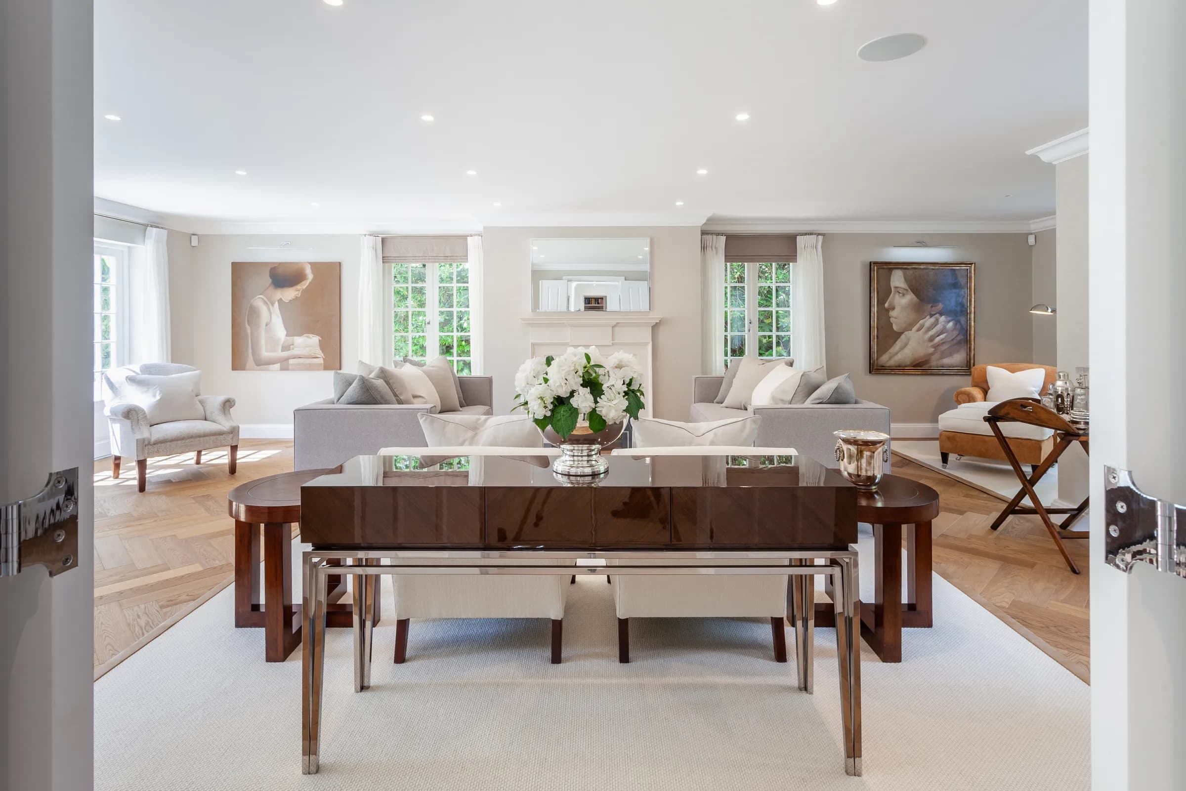 Grand foyer with console table, sculptural arrangement and classical interior detailing